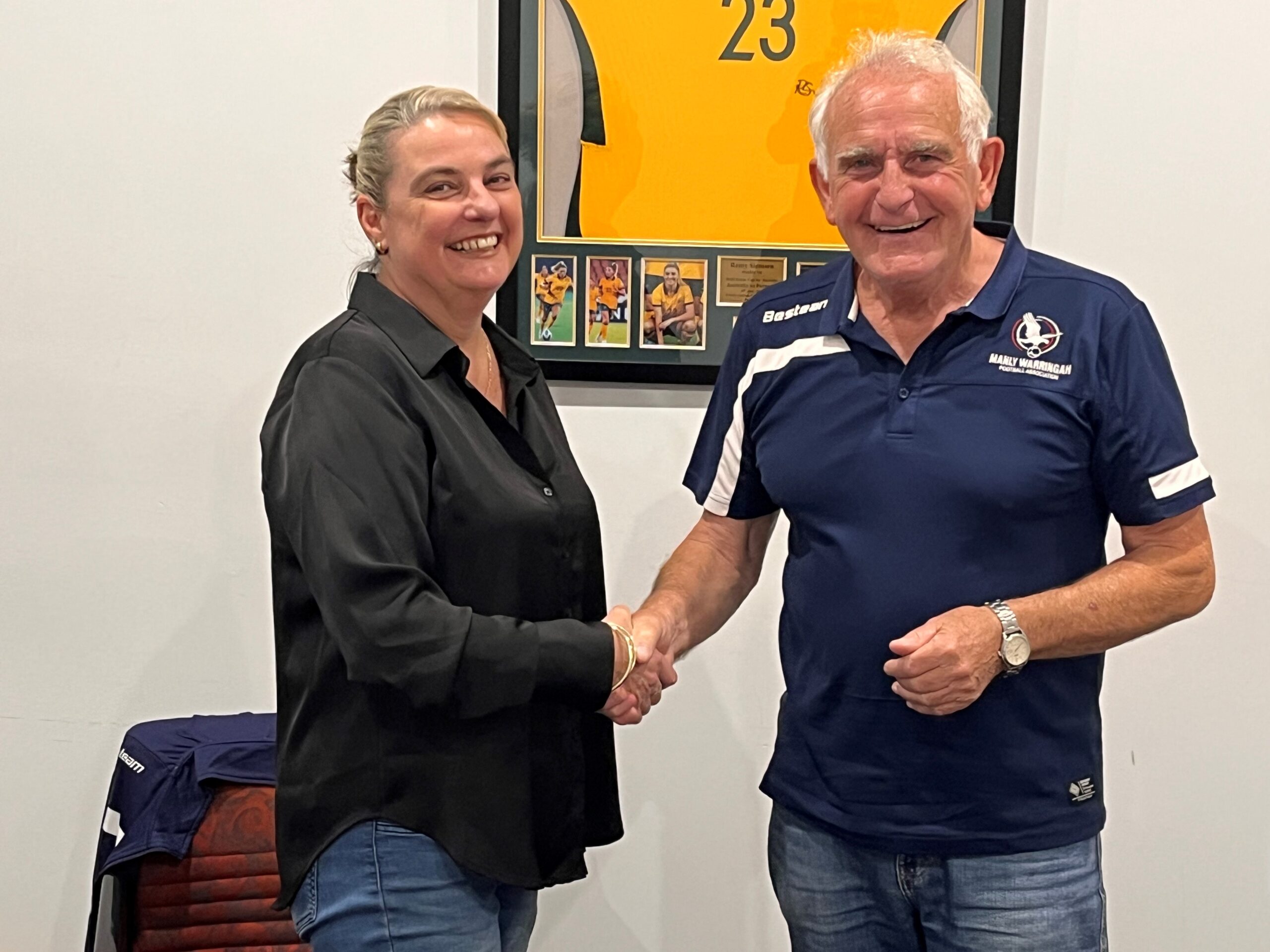 New Manly Warringah FA / Manly United FC CEO Vicki Halpin shakes hands with MWFA Chairman David Wilson.